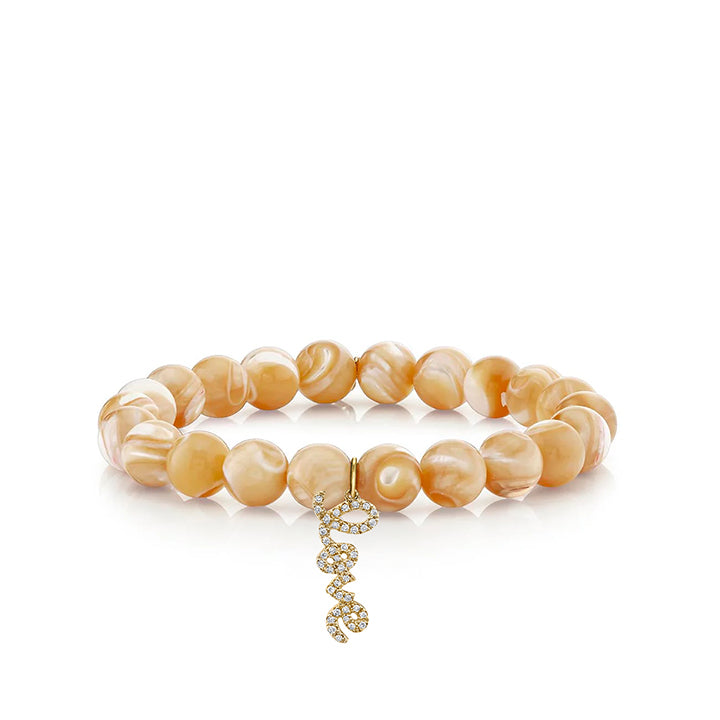 LOVE SCRIPT CHARM ON TAN MOTHER OF PEARL ROUND